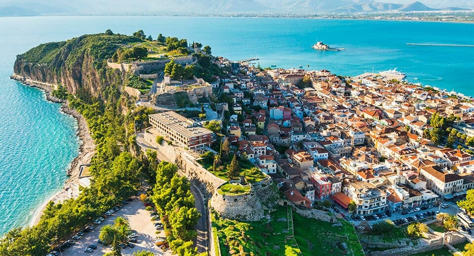 Aerial coastal town and turquoise sea, seaside exploration vista