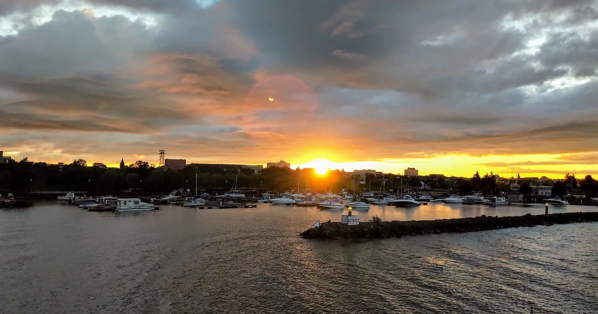 Sunset harbor panorama with cruise ship arriving at dusk