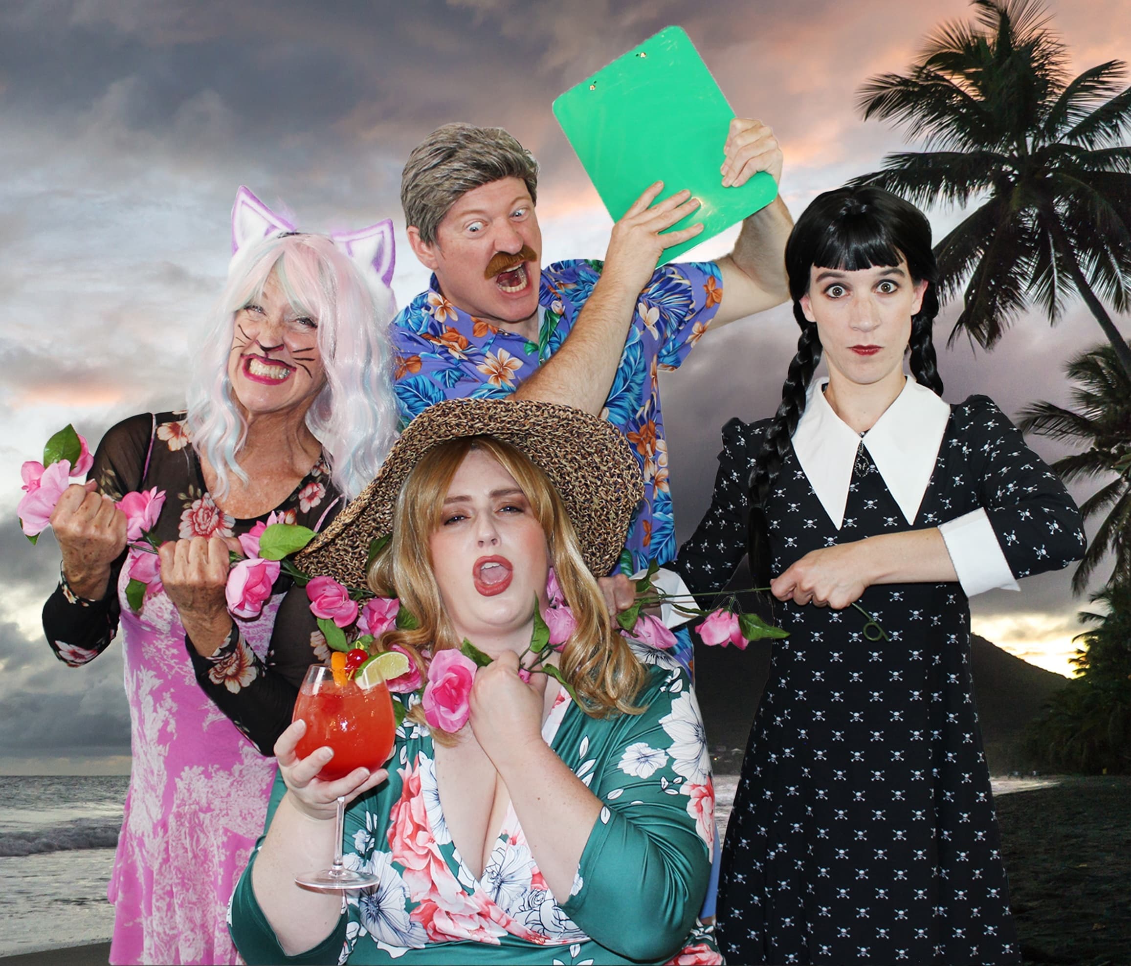 Costumed group posing on tropical beach backdrop at sunset