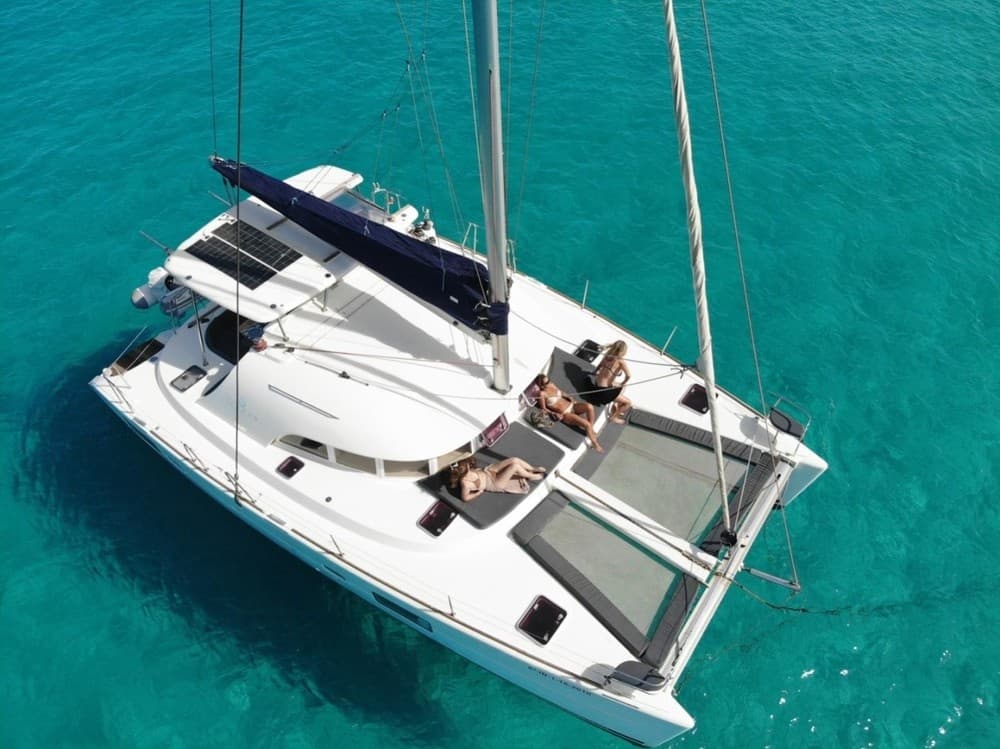 Catamaran sailing on turquoise waters off Málaga coast