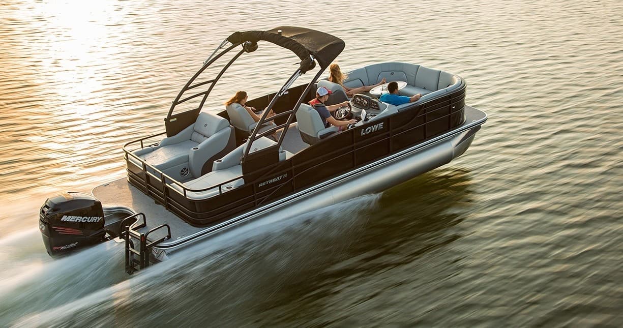 Pontoon boat at sunset on calm coastal waters near Fort Lauderdale