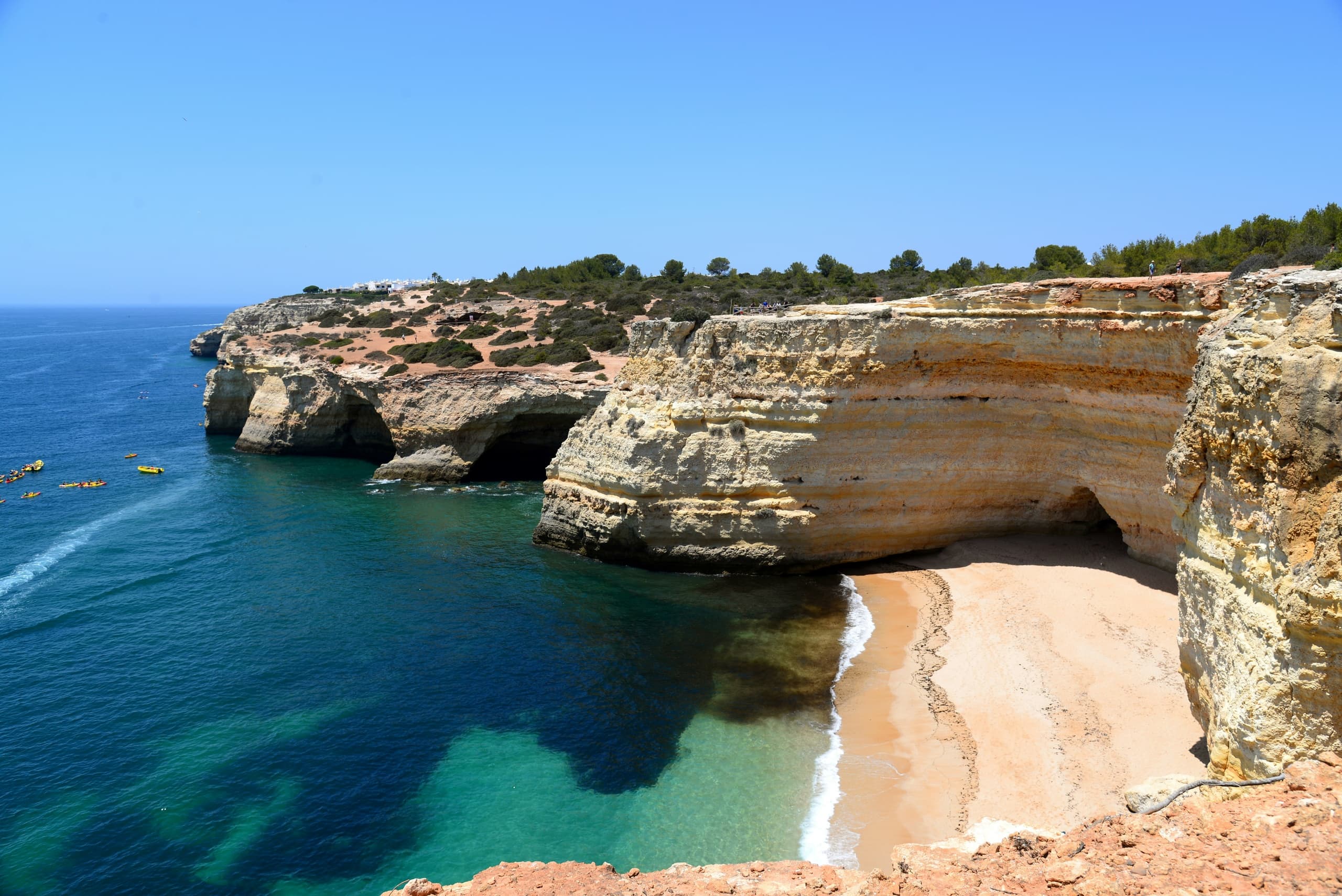 Dramatic coastal cliffs and sandy beach at Benagil, Algarve