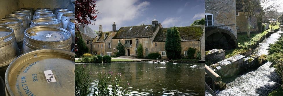 Riverside brewery barrels and stone-mill cottages by flowing stream