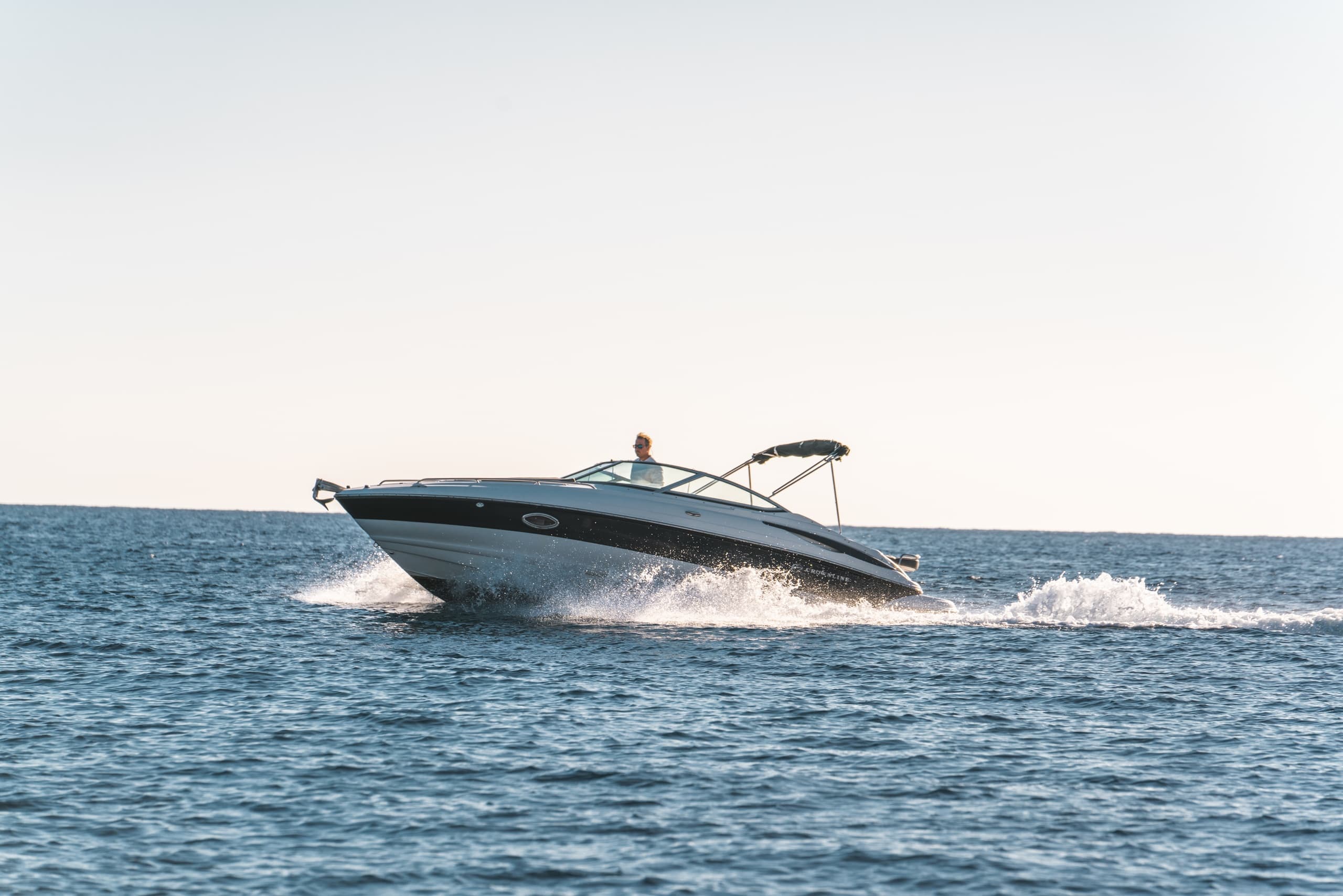 High-speed boat cutting through open Aegean Sea near Santorini