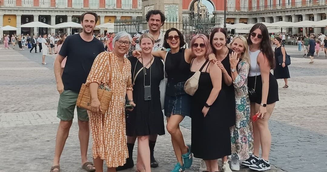 Small group posing in historic Plaza Mayor square, Madrid