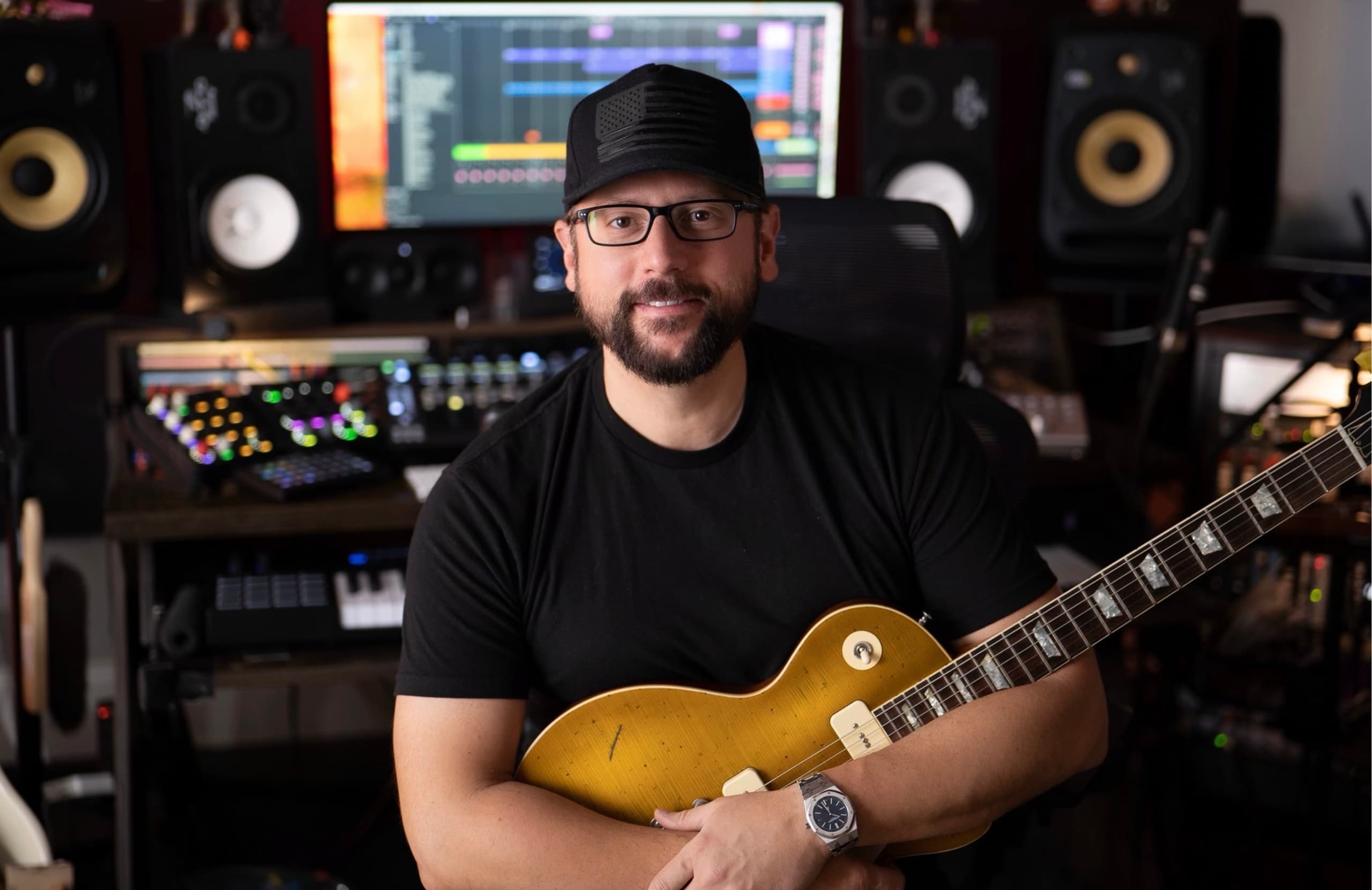 Guitarist holding electric guitar in recording studio session