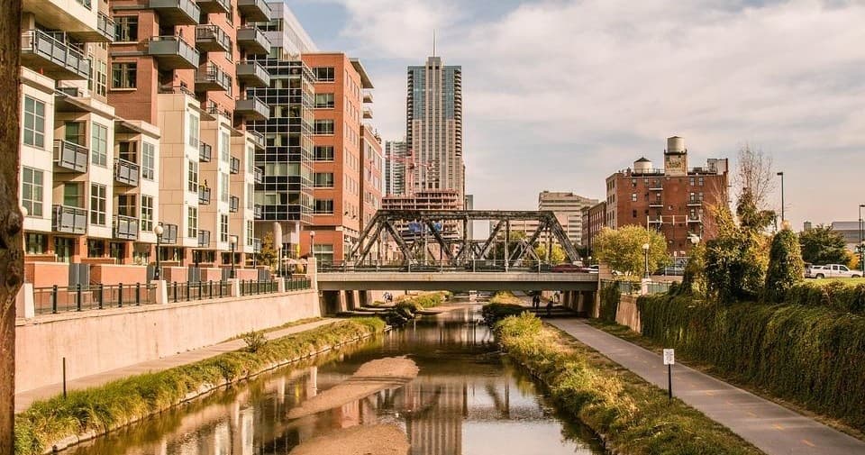 Urban riverside walk along scenic canal in Denver neighborhood