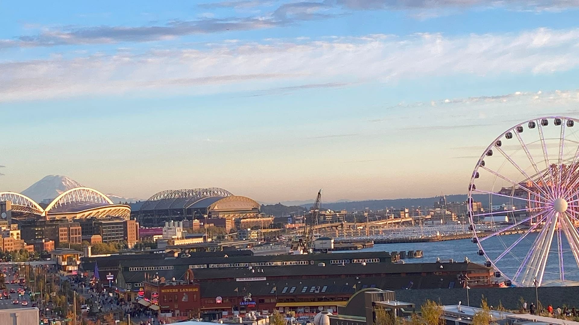 Seattle waterfront skyline with Great Wheel at sunset, harbor view