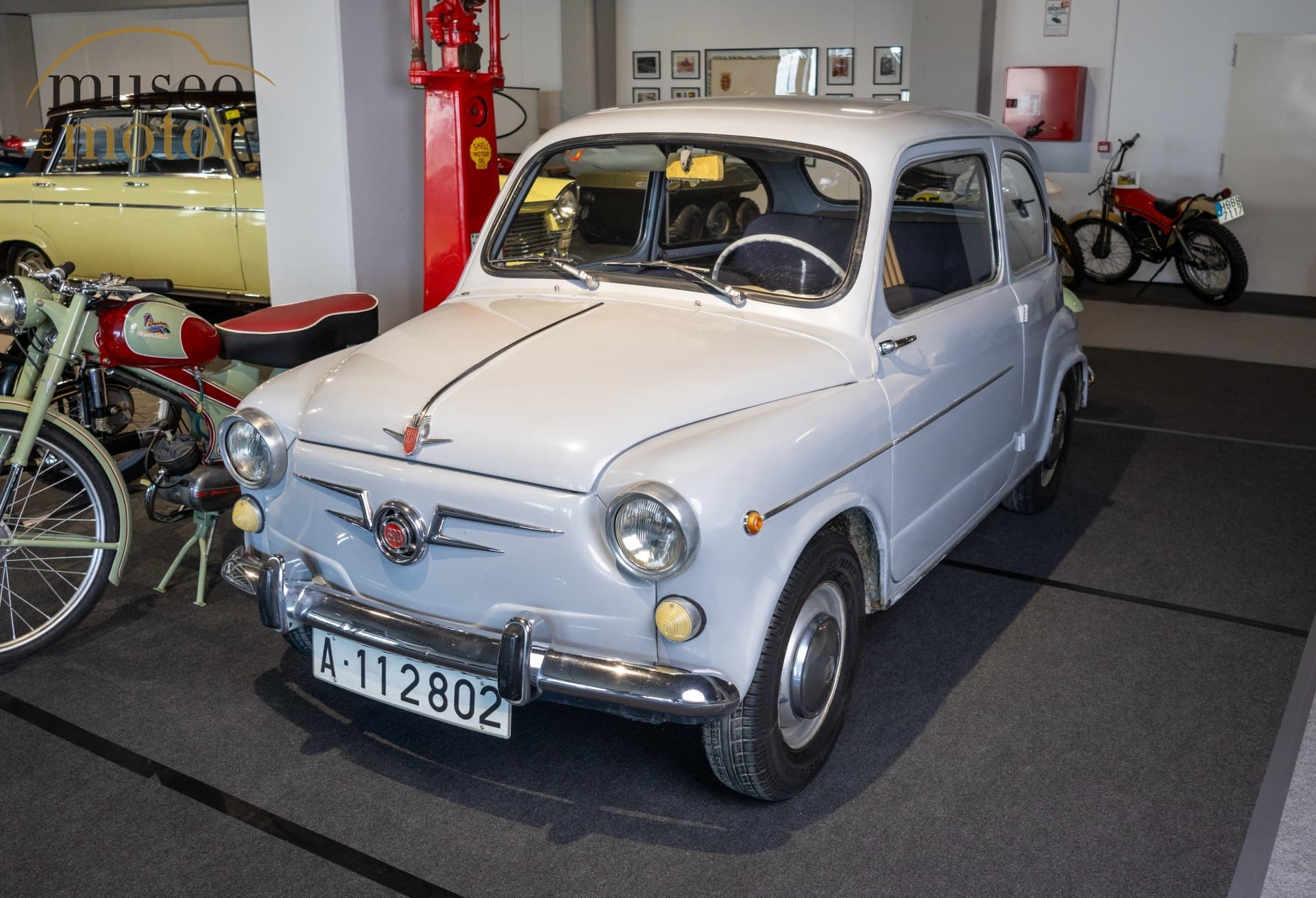 Compact classic city car displayed indoors in Museo del Motor gallery