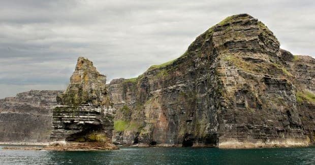 Sea stack rock formation on rugged Irish coastal hike