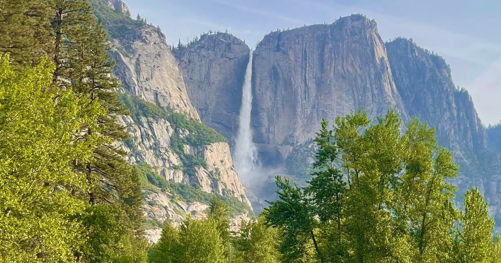 Yosemite valley view with waterfall and granite cliffs