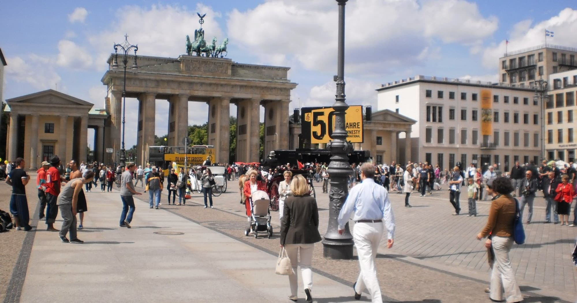 Guided walking tour at Brandenburg Gate plaza with crowds