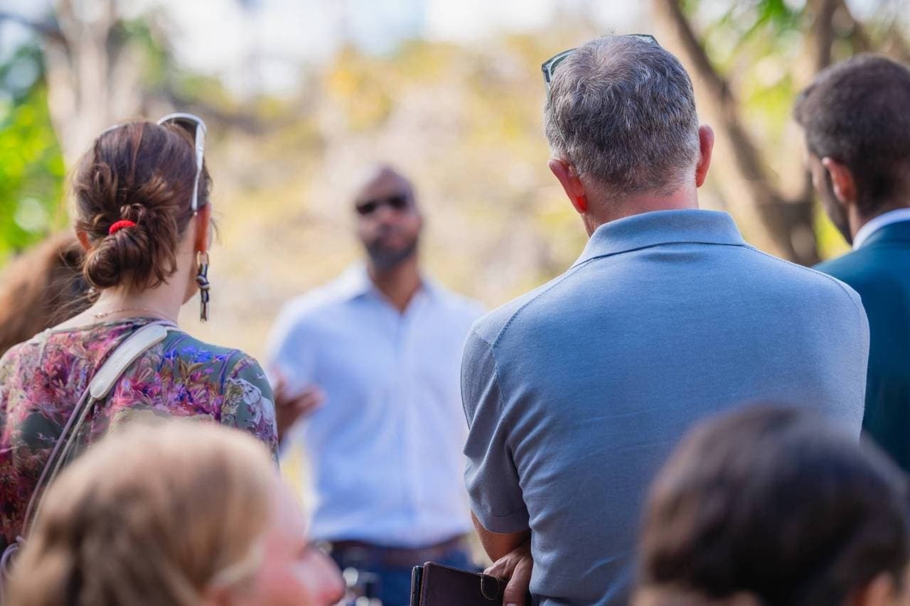 Outdoor audience listening to guide during island cultural talk