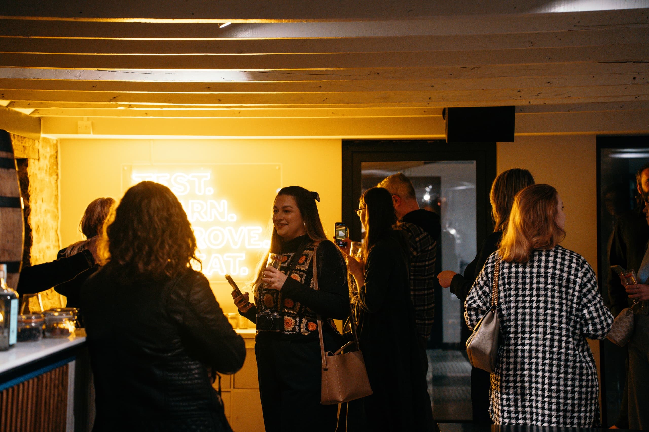 Guests socializing at indoor Holyrood Distillery tasting event