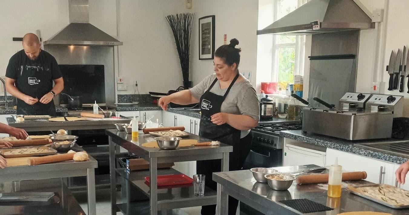 Cooking class chefs preparing food in professional kitchen studio