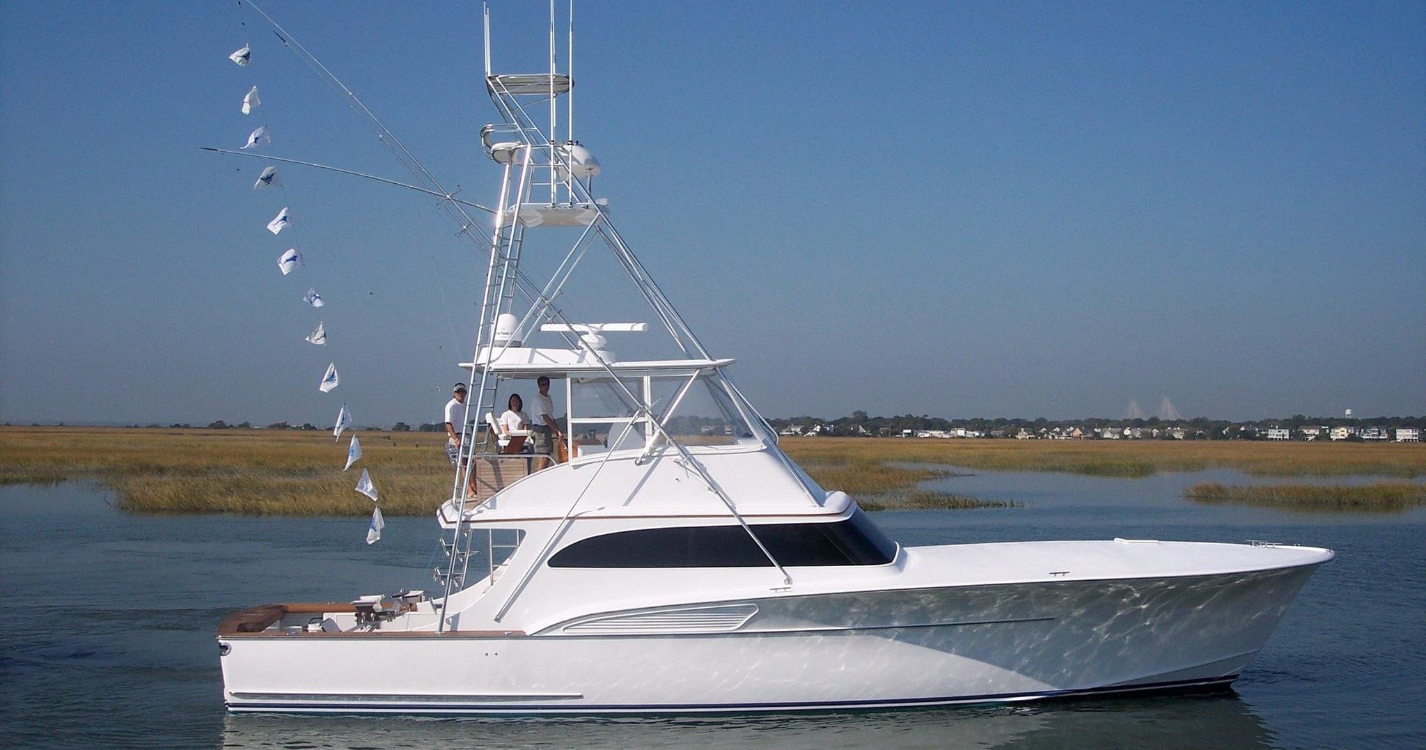 White sportfishing yacht cruising Charleston coastal waters