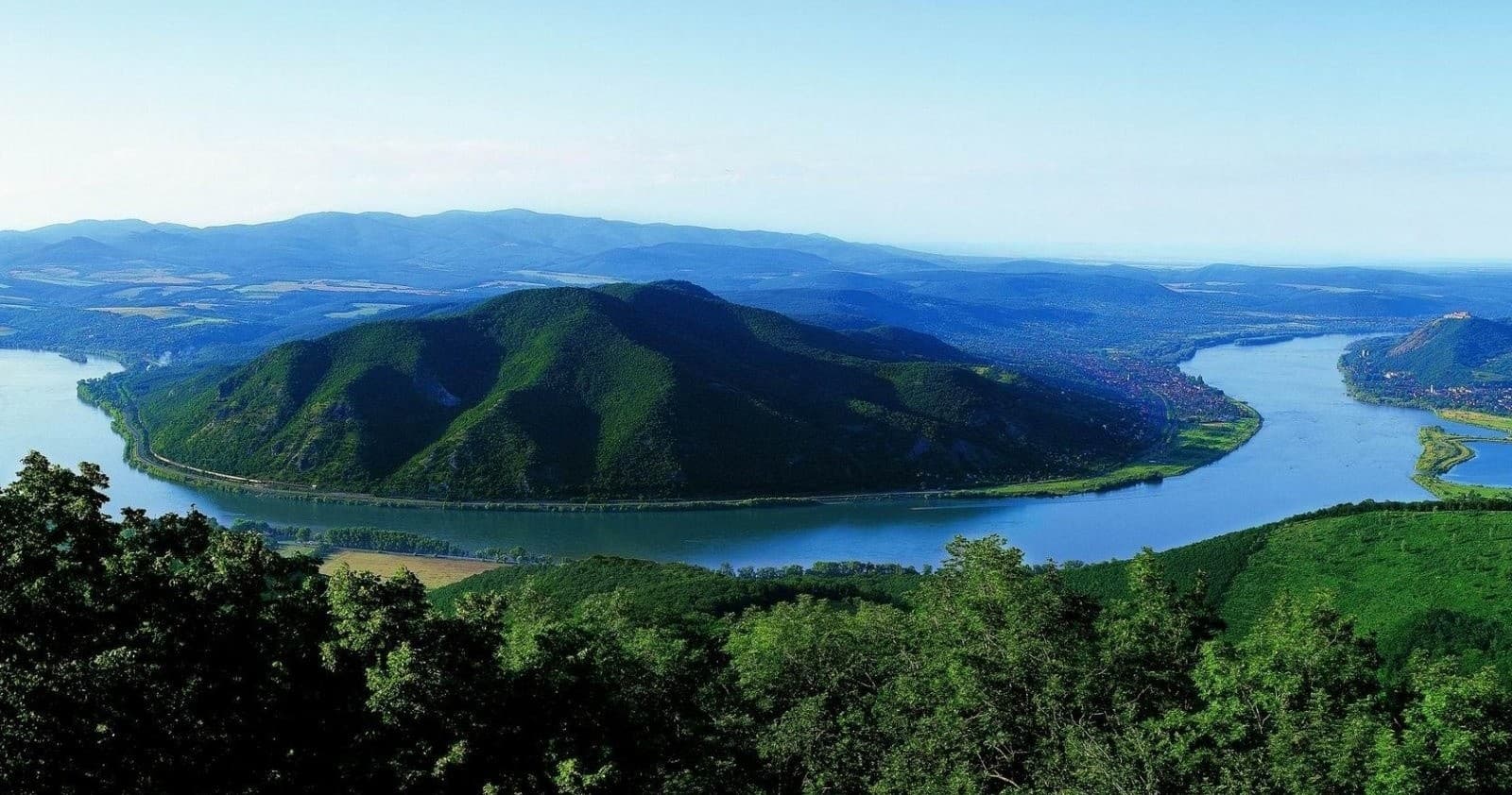 Scenic Danube Bend river curve with green hills and forests