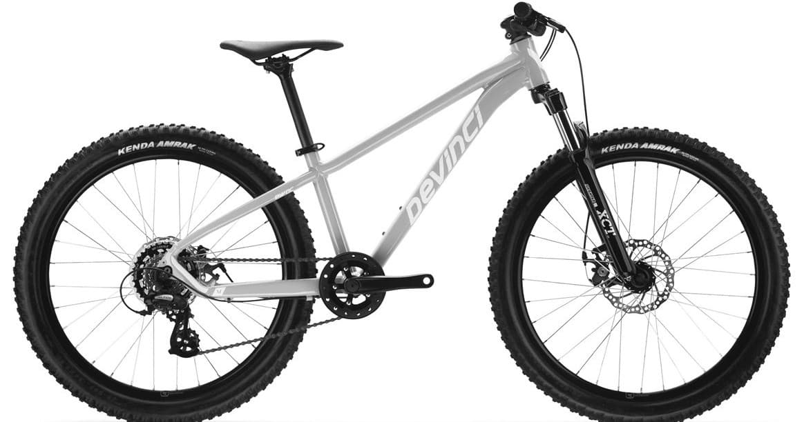 Silver mountain bike product shot on studio backdrop, rugged