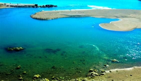 Aerial turquoise lagoon with sandbars, coastal marine scenery