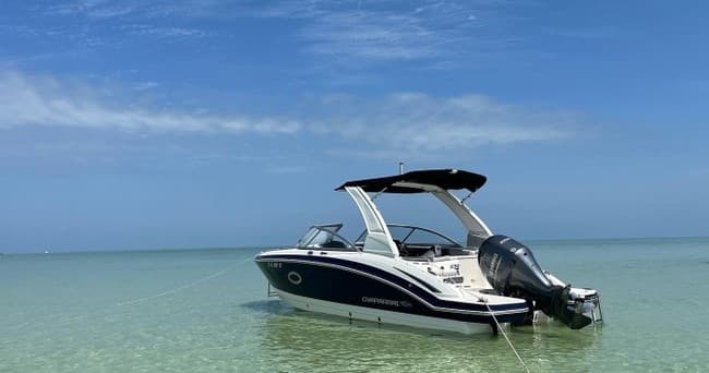 Powerboat anchored in shallow turquoise waters, coastal Florida