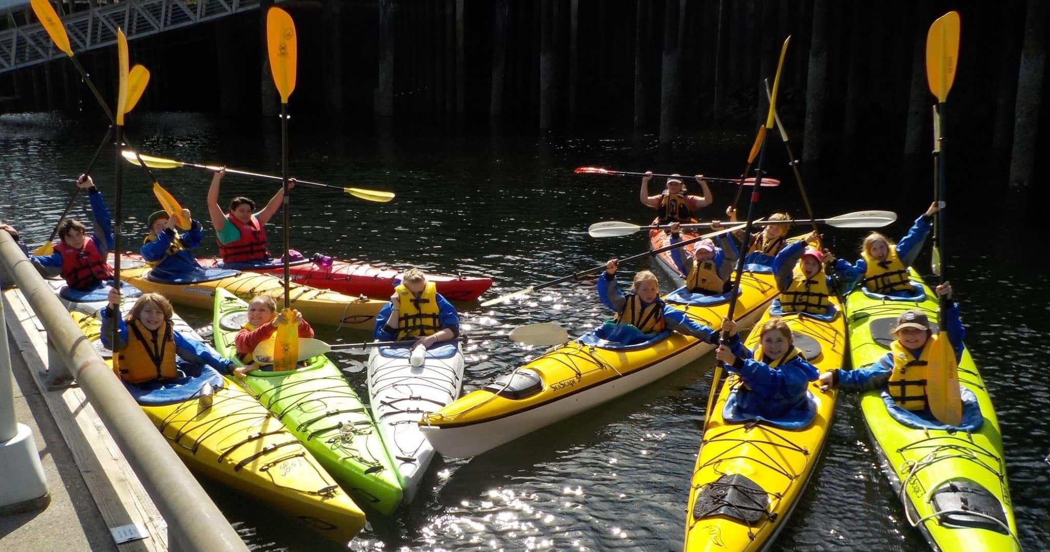 Guided sea kayak group launching from dock in Ketchikan, Alaska