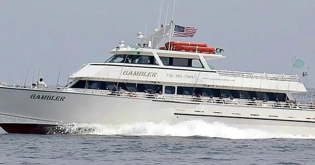 Gambler fishing charter boat cruising offshore on open ocean