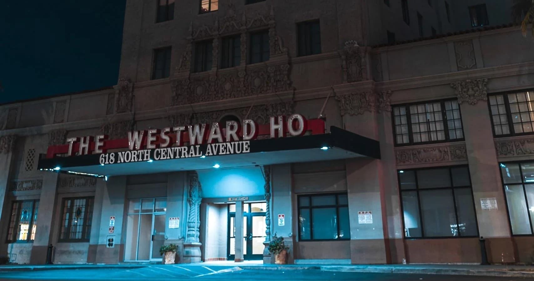 Historic Westward Ho hotel exterior at night on city street