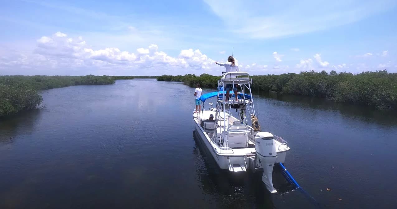 Fishing boat cruising mangrove waterways in Crystal River, Florida
