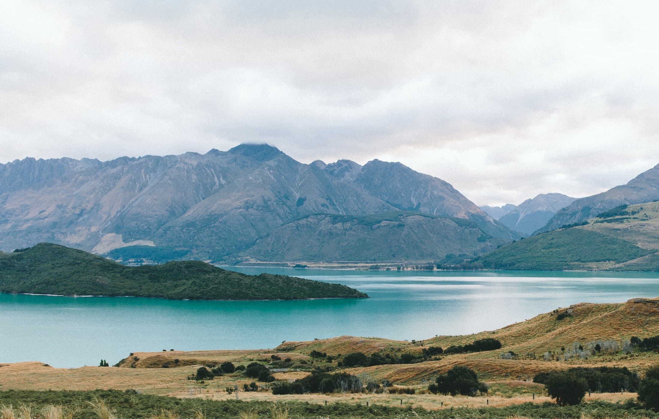 Mountain lake landscape in Scottish Highlands for lakeside hiking
