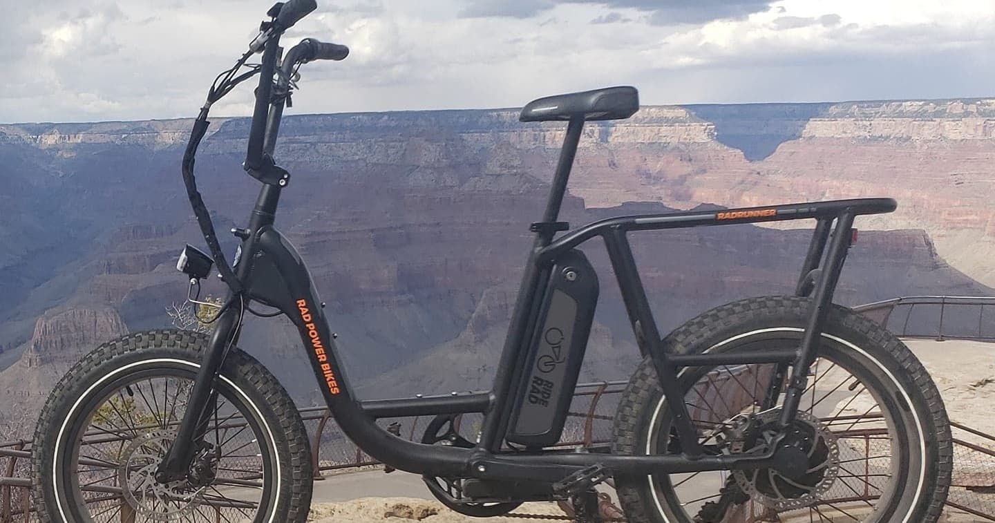 E-bike parked on Grand Canyon rim with scenic canyon view