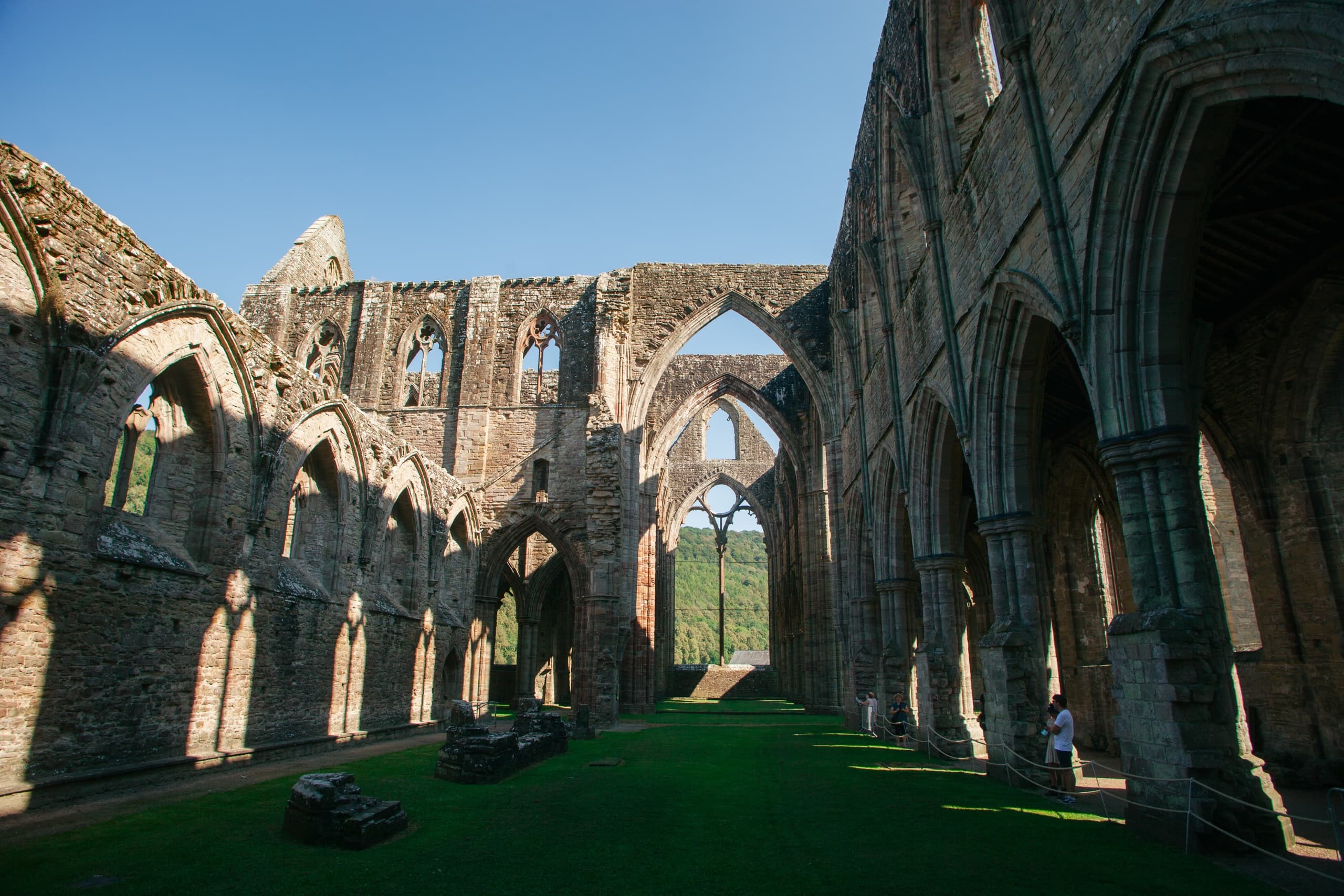 Historic abbey ruins with vaulted arches on heritage site tour