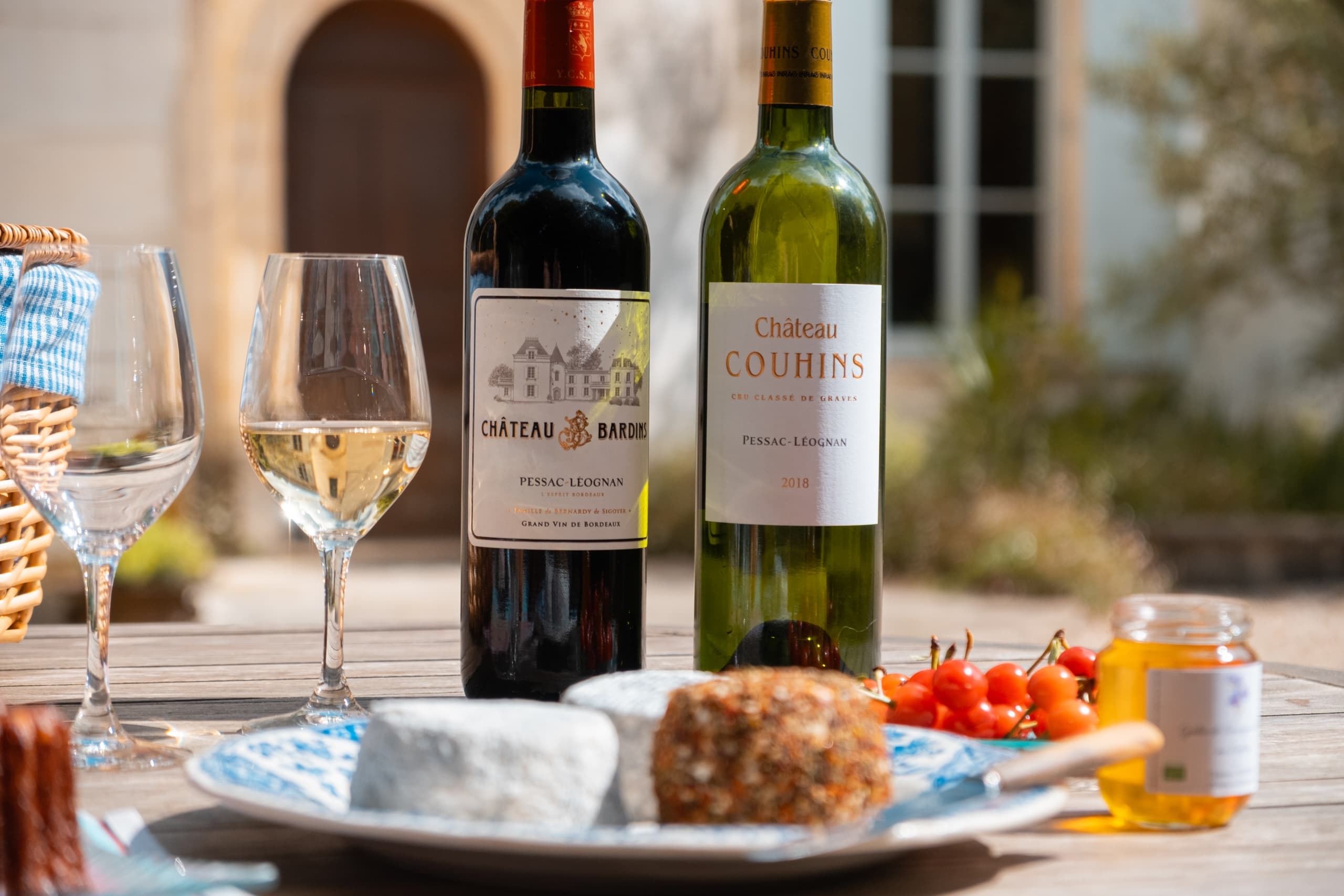 Outdoor wine tasting picnic at Chateau Couhins with cheeses