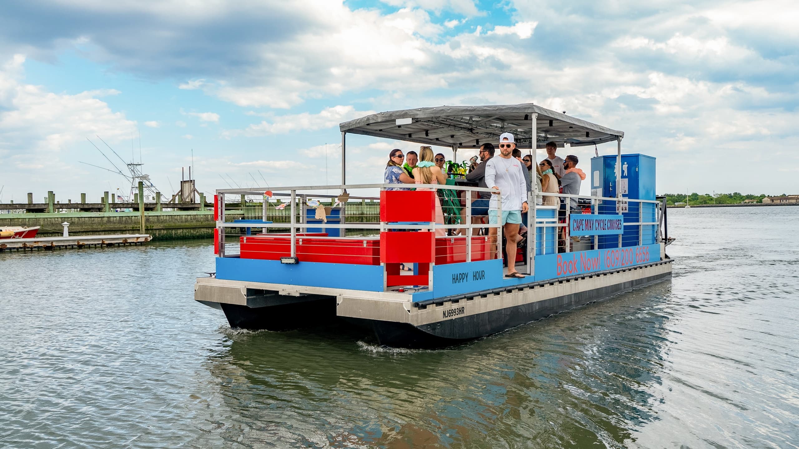 Group cruise on sightseeing ferry through coastal marina, Jersey Shore