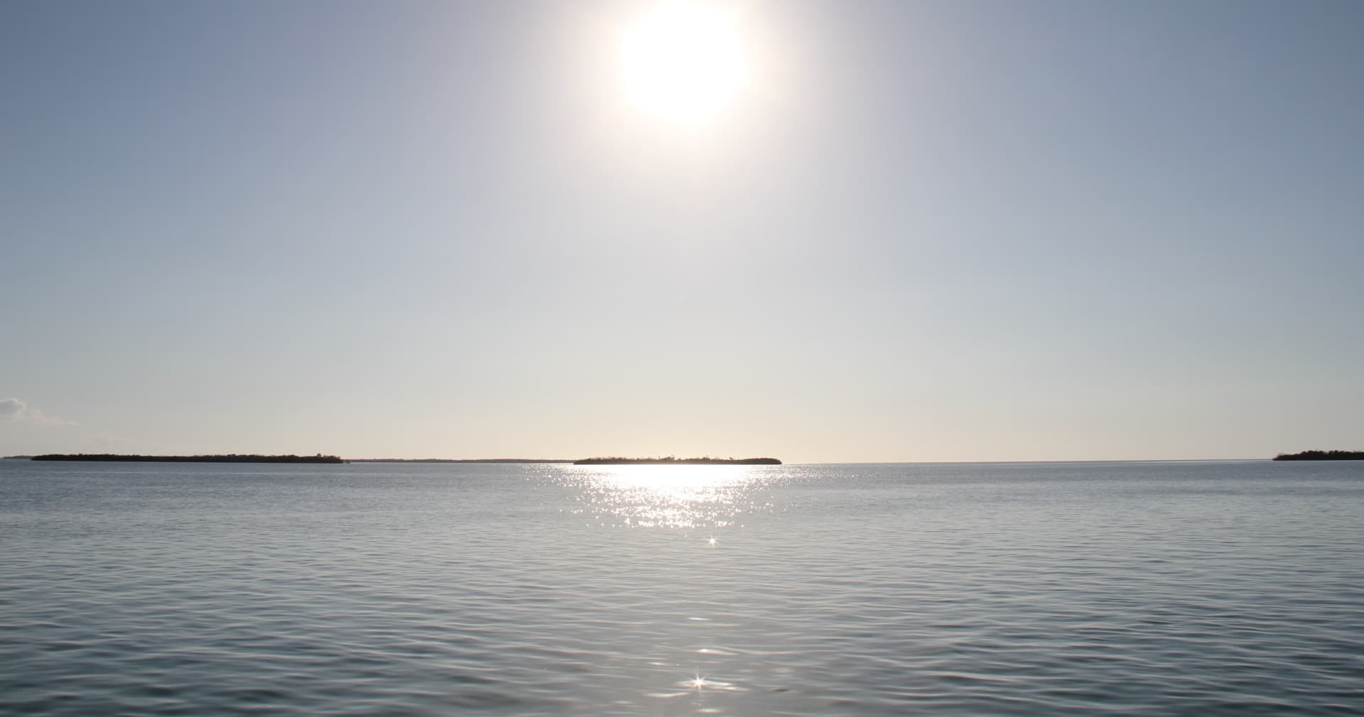 Sunrise over open ocean horizon for coastal kayaking trips
