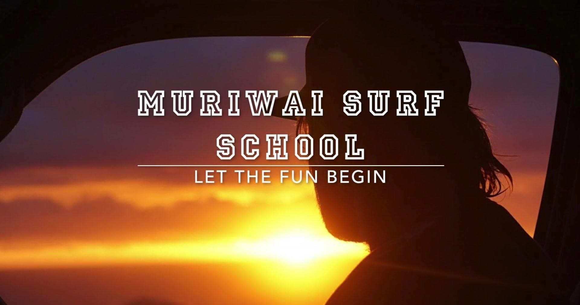 Silhouette watching sunset at Muriwai Beach surf school