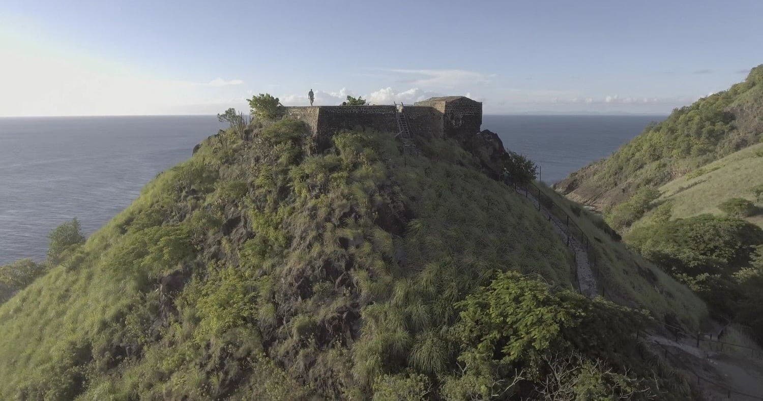 Sightseeing at historic hilltop fort above coastal ocean cliffs