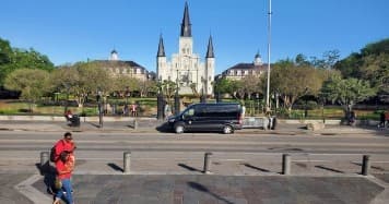 St. Louis Cathedral and Jackson Square plaza with street activity