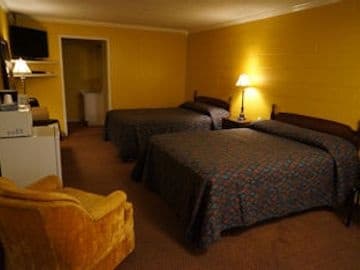 Cypress Springs resort double bedroom with beds and warm lighting