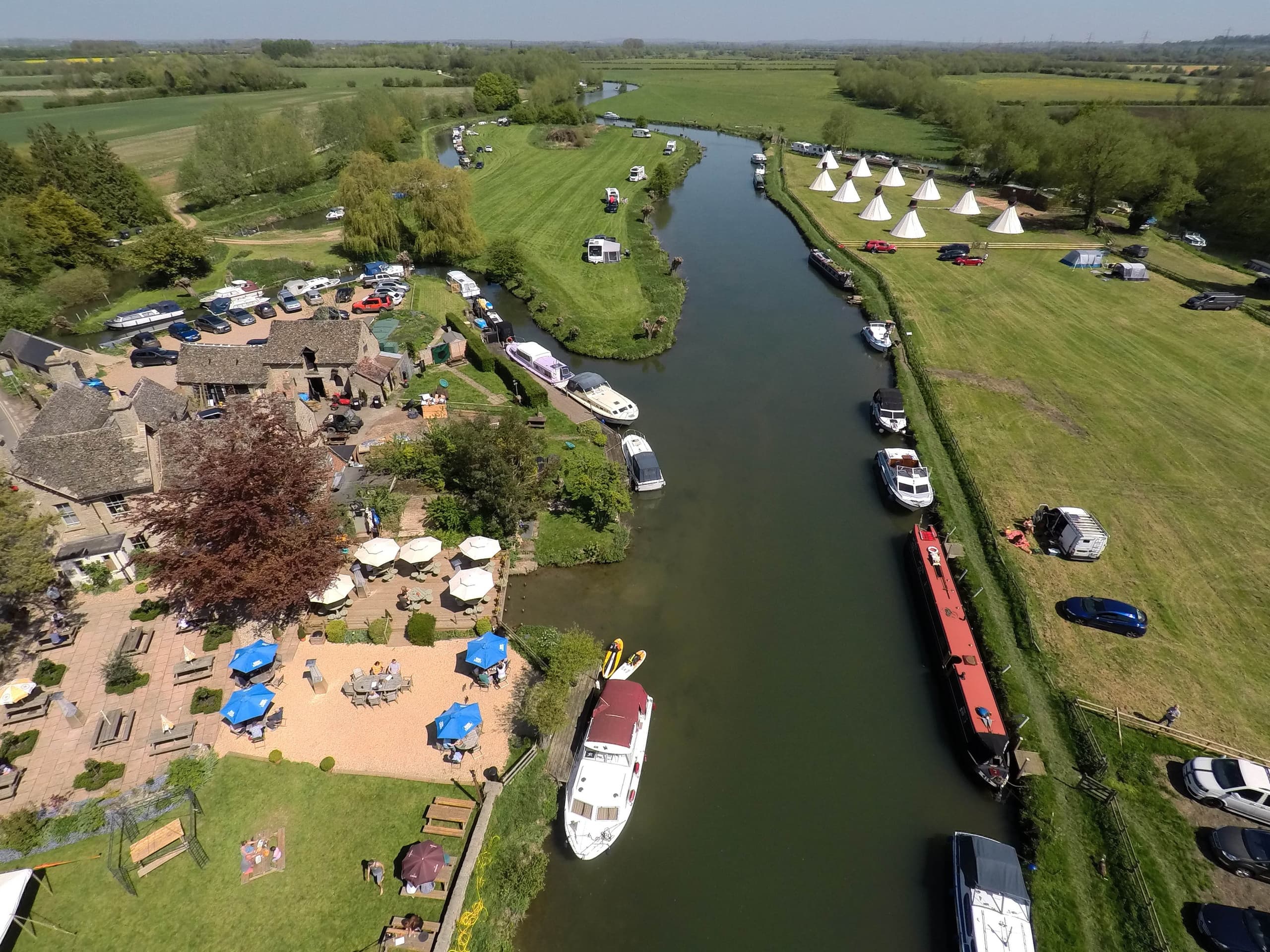 Aerial view of canal marina and campsite along Cotswold waterway