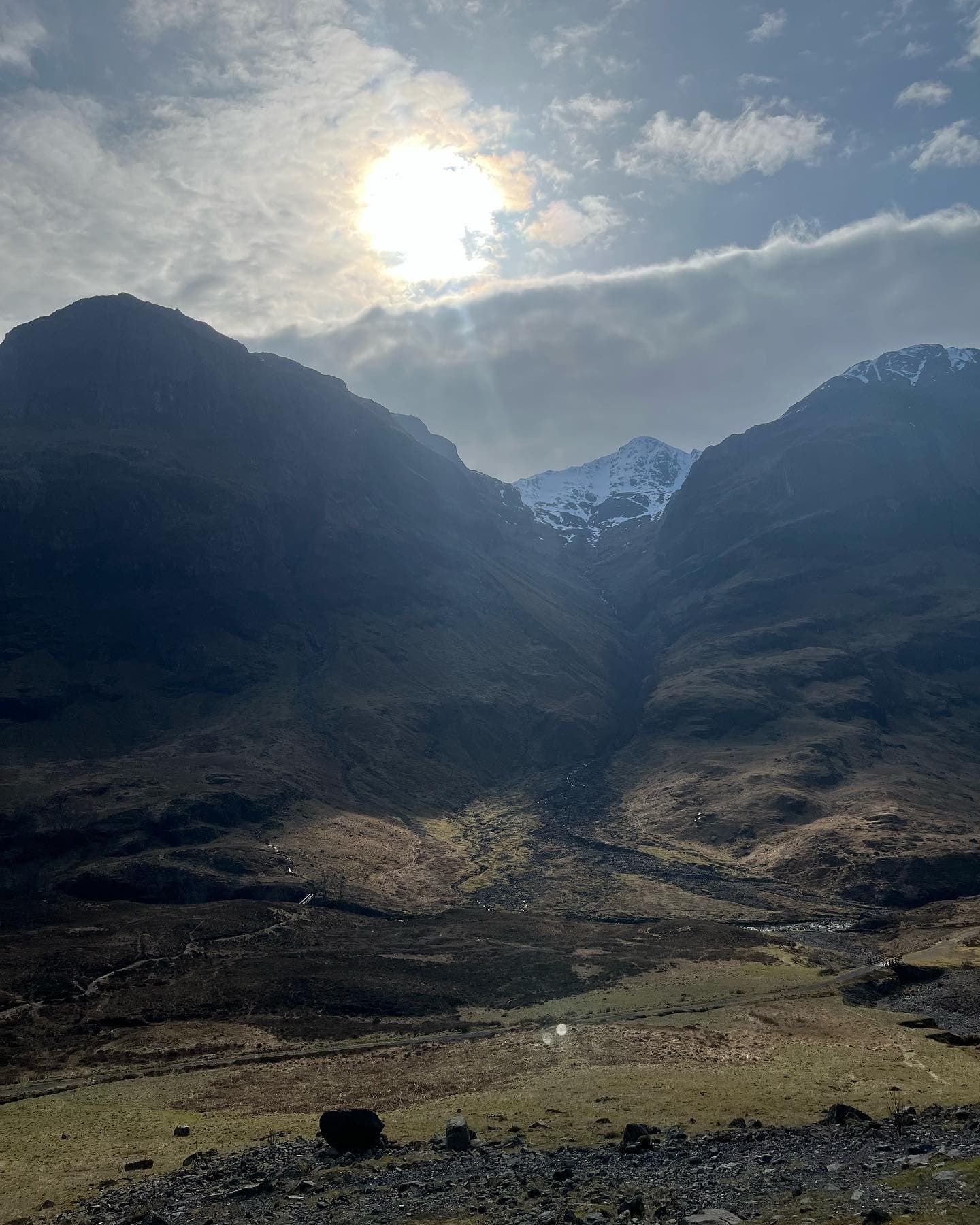 Dramatic mountain glen valley at sunrise, remote Scottish Highlands