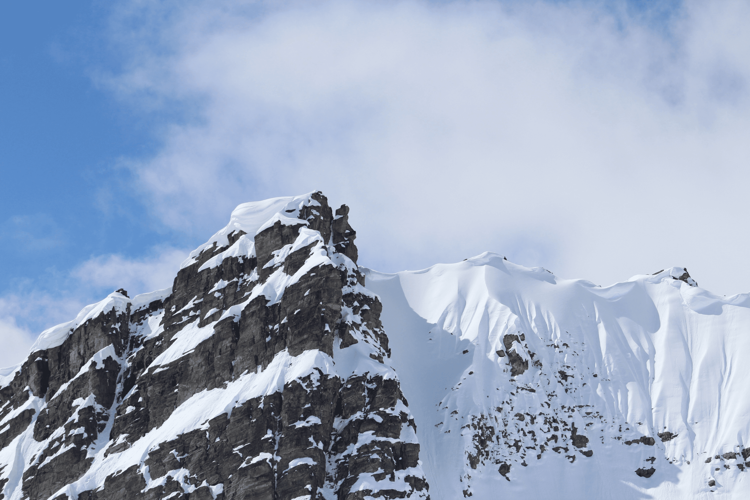 Snow-covered alpine peaks for backcountry skiing in Canada