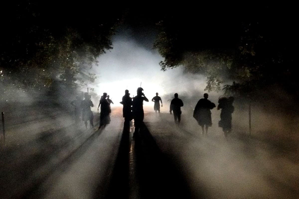 Mystical foggy night tour silhouettes on Kona street, Hawaii