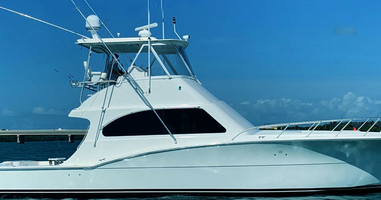 Sportfishing yacht offshore on blue sea ready for charter