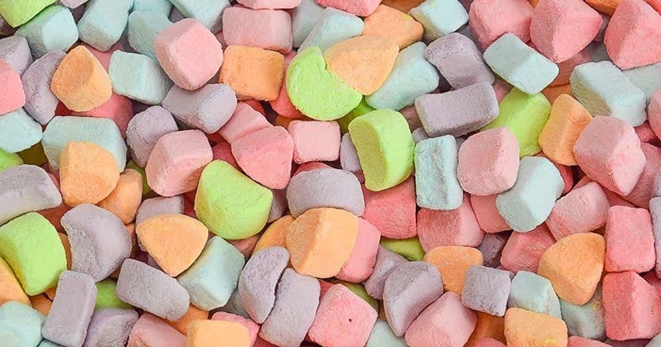 Pastel mini marshmallows piled in pastel confection display