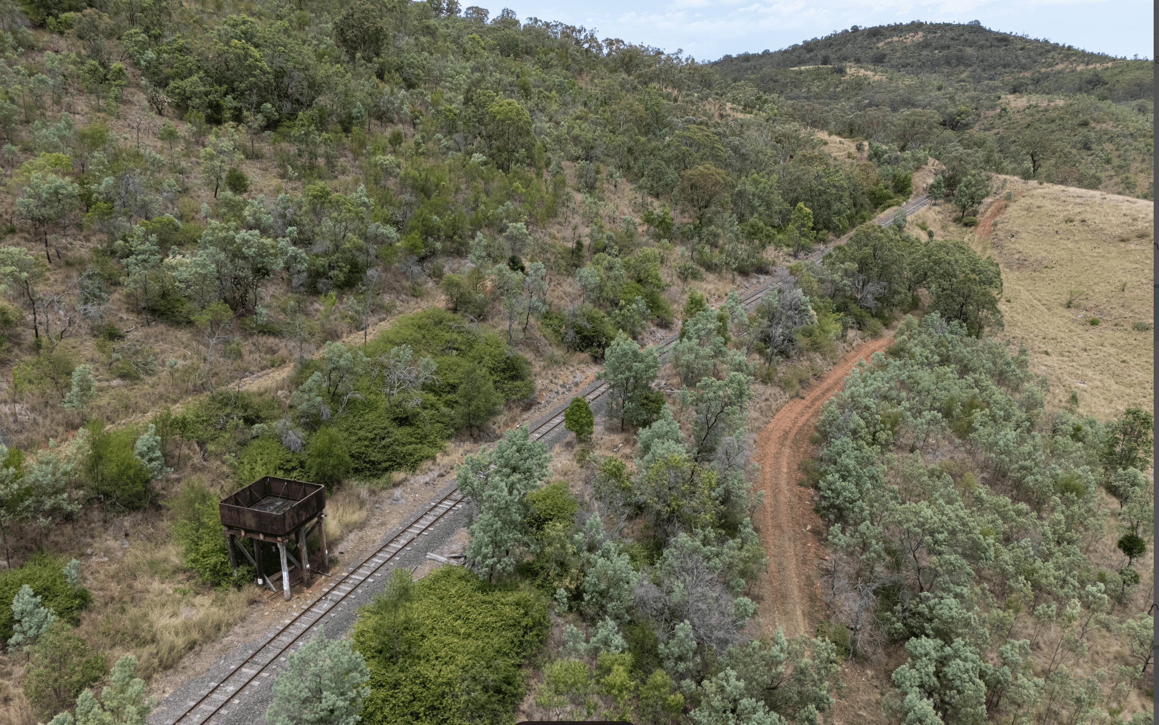 Aerial shot of abandoned rail siding and bushland exploration