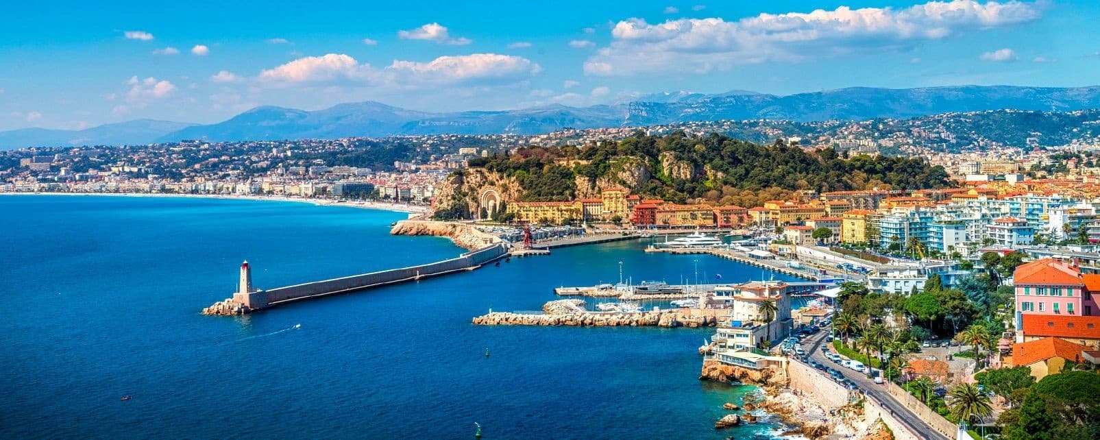 Panoramic coastal view of Nice harbor and Mediterranean promenade