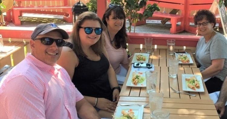 Group enjoying Cape May outdoor food tour on sunny patio
