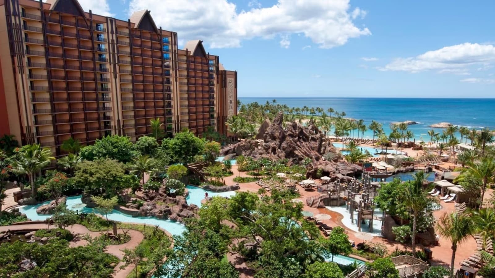 Aerial resort coastline view with pools and oceanfront vacation setting