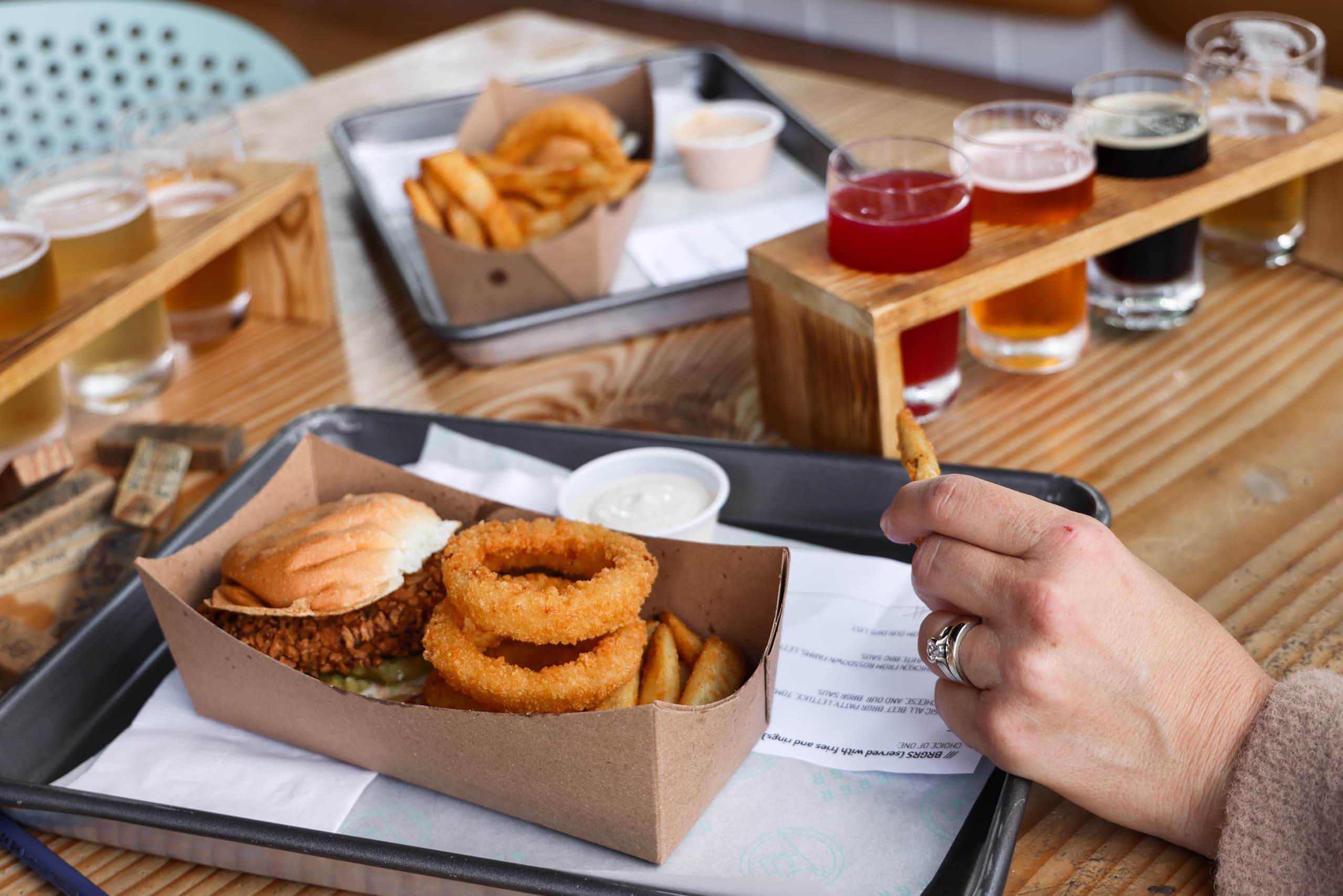 Beer flight and casual snacks on a sunny outdoor patio
