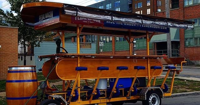 Side view of empty pedal wagon on Columbus city street